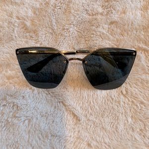 Prada Polarized sunglasses in gold/grey